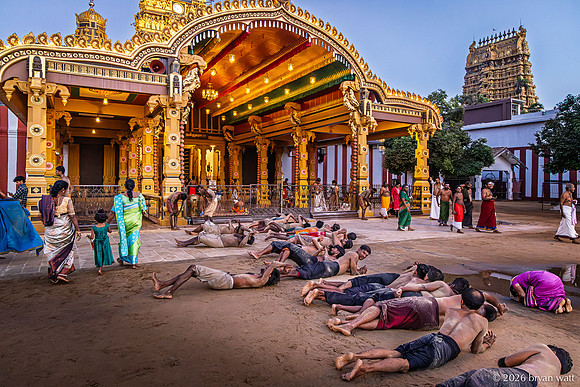 Rolling Devotion Beneath the Golden Entrance