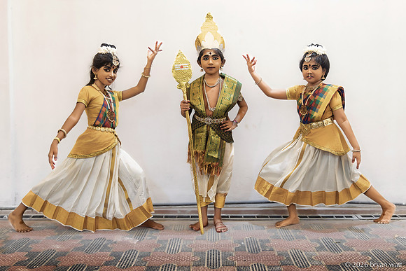 A Vel-Bearing Figure and Two Dancers